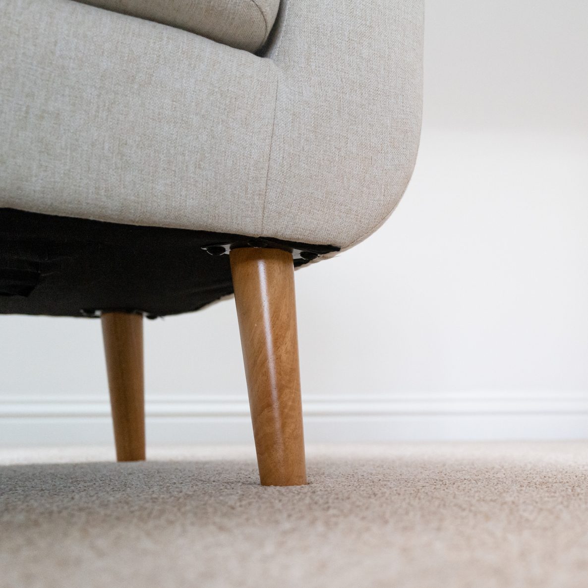 Carpet level view of a modern bedroom chair.