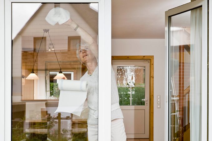 Woman Cleaning A Window