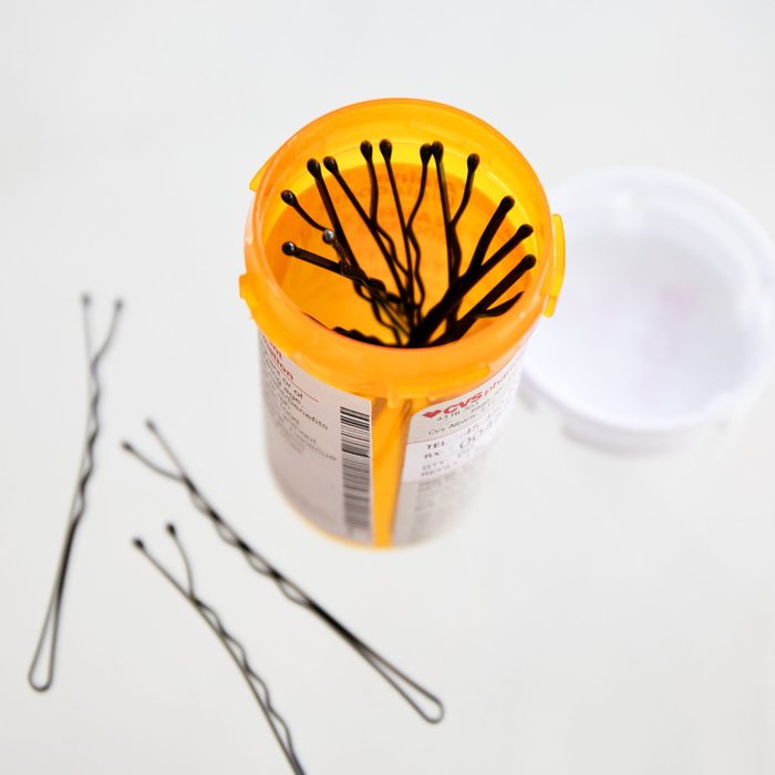 using a recycled pill bottle to store bobby pins