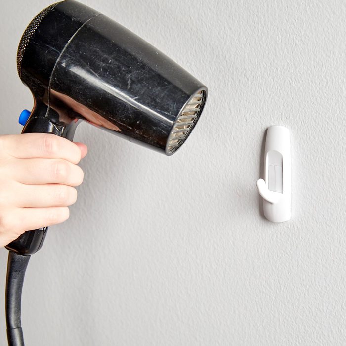 using a hair dryer on a stuck command hook