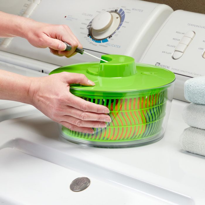 using a salad spinner to remove excess water for faster drying
