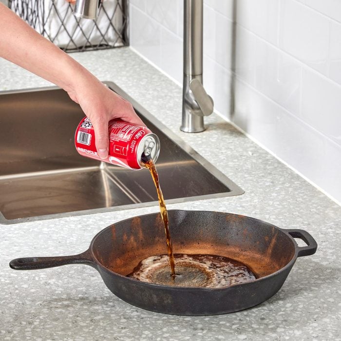 cleaning a cast iron pan with coca cola