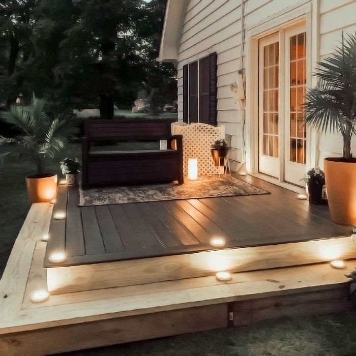 Floating Deck with steps and lights at night