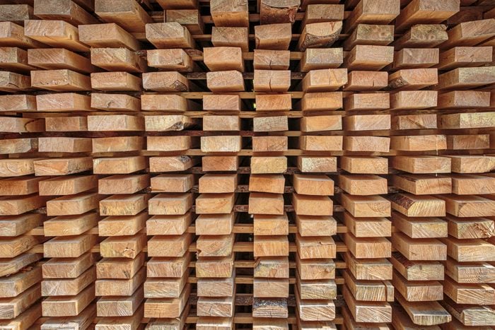 Stack wooden planks air drying at the lumber yard, north Finland.