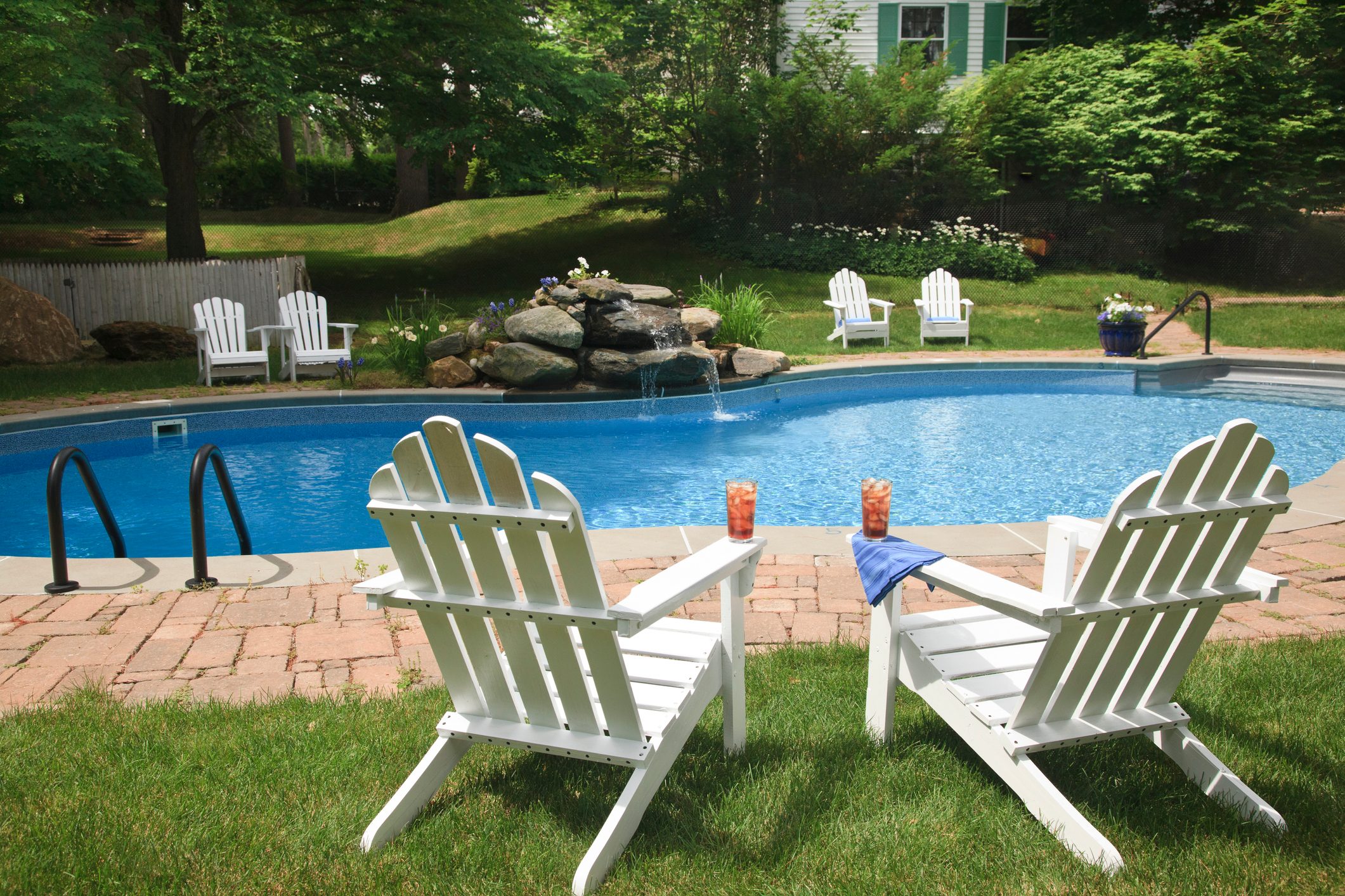 Swimming pool with white chairs