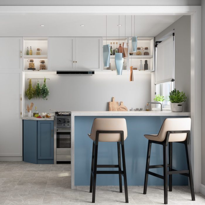 Modern Kitchen Interior With Kitchen Island, Blue And White Cabinets And Chairs