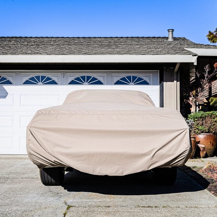 Covered car in a driveway