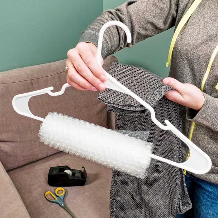 wrapping a hanger in bubble wrap to hang pants on