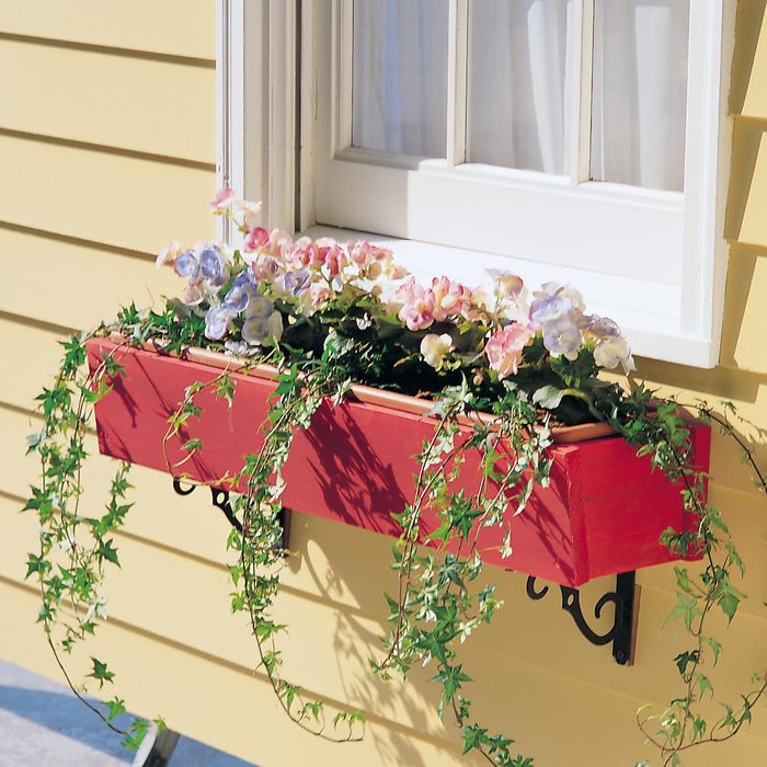 Diy Wooden Window Planter Box; red box against a house with yellow siding