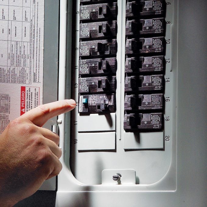 finger pointing to Arc Fault Circuit Interrupter