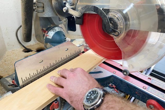 using a circular saw to cut wood for the frame