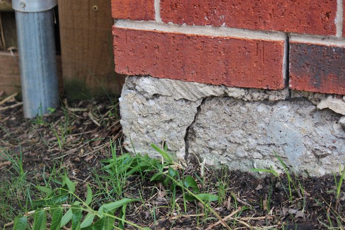 Crack in the wall joint of a home exterior indicating concrete slab foundation problem