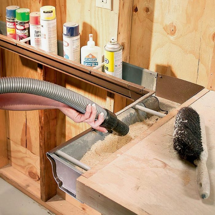 using gutters to catch sawdust in a workshop