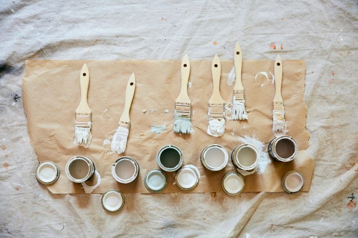 Overhead shot of paint brushes and paint samples.
