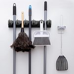 This Mop and Broom Holder Instantly Declutters Your Cleaning Closet or Garage