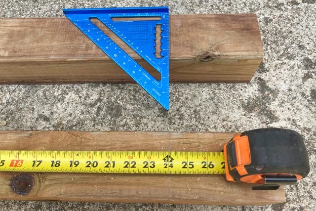 making measurements on pieces of wood for the table legs