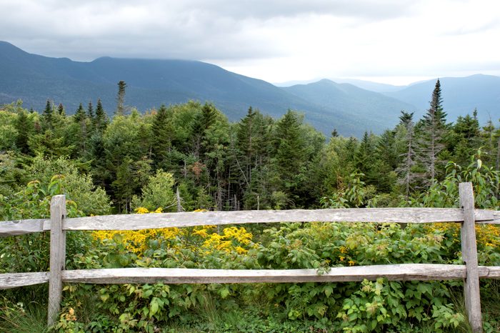 split rail fence with a Mountain View in the background in New Hampshire