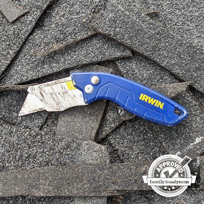 Irwin Pro Flip Utility Knife on a pile of roofing material with the family handyman approved logo in the bottom right corner