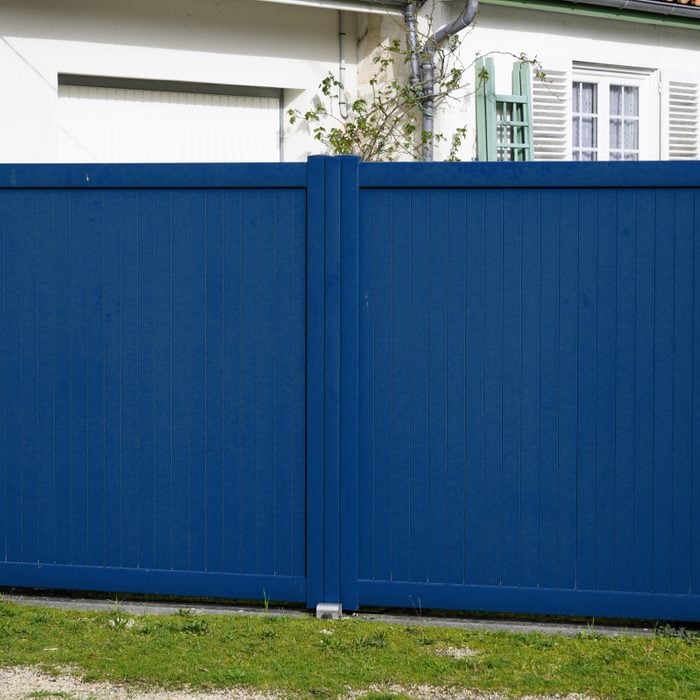 Blue Vinyl Fence in a residential backyard