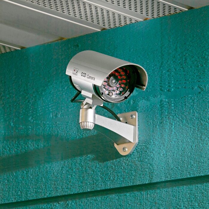 home security camera on a teal wall