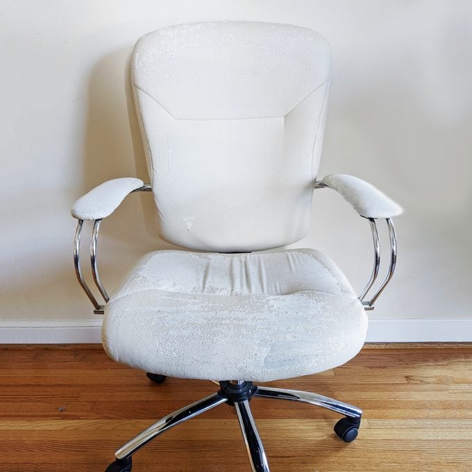 white office chair before being reupholstered