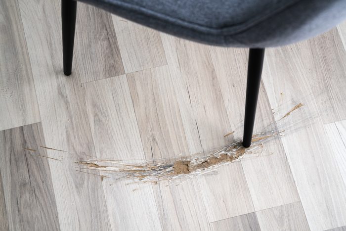 gouge in vinyl plank Flooring from a chair