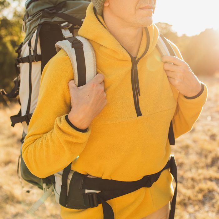 Gettyimages 1351937054 Smiling Young Man Wearing Backpack Standing On Autumn Forest Trail By Anastasiia Krivenok
