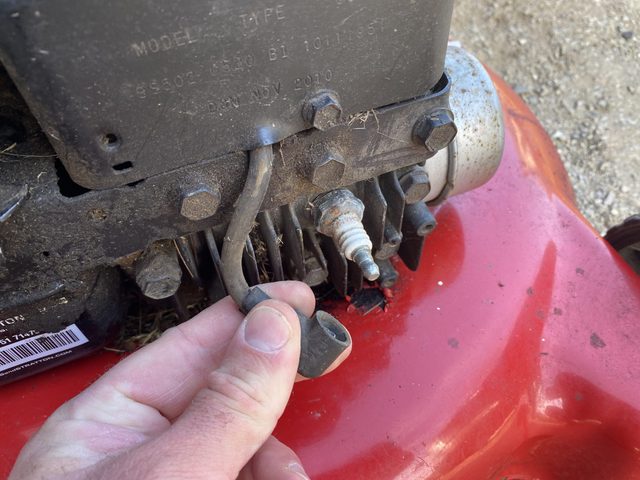 Locate and disconnect the spark plug wire