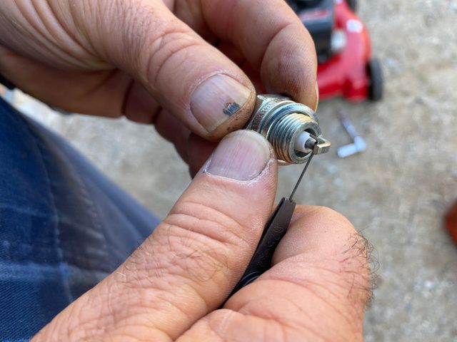 Inspect the new spark plug