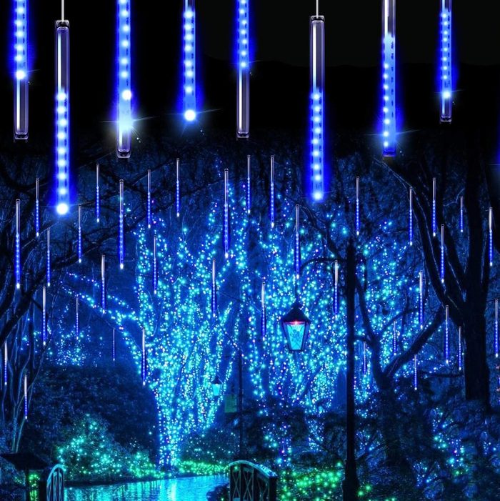 blue icicle lights decorating an outdoor scene for christmas
