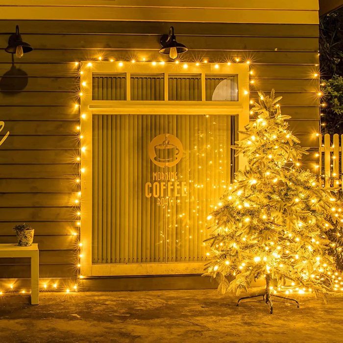 yellow christmas lights on a christmas tree outside