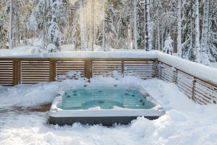 Hot tub in winter landscape