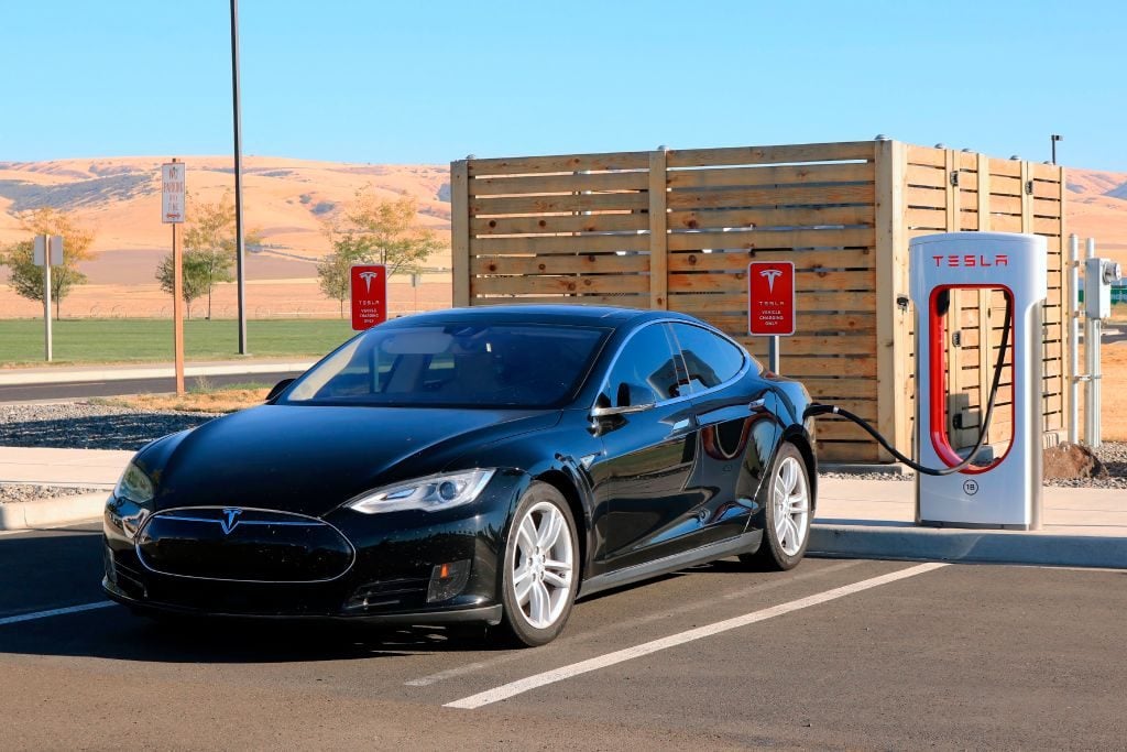 Tesla electric car at charging station