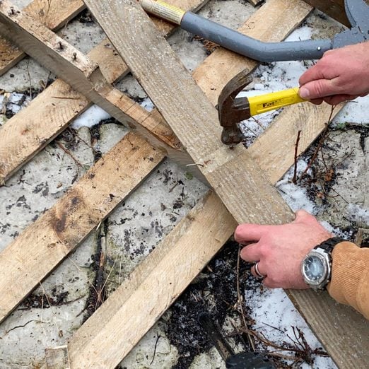 Pounding Out Nails on a pallet