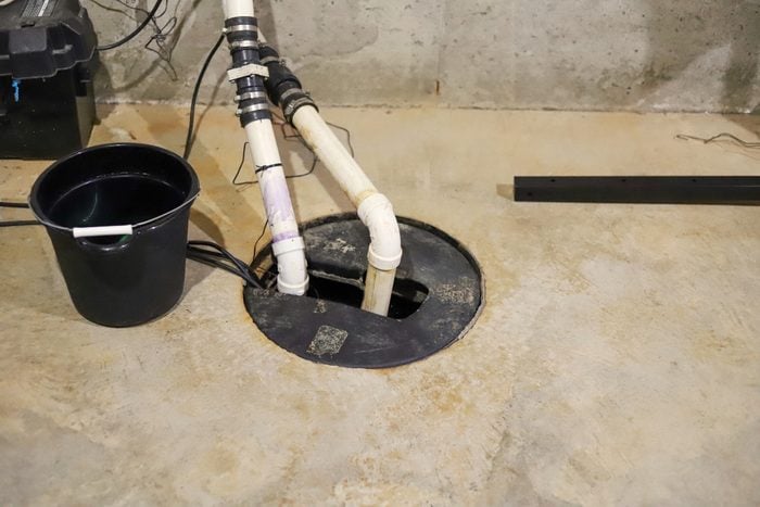 A sump pump in a home basement