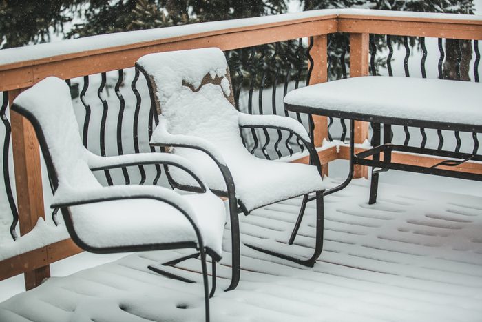 Patio Chairs and Table covered in snow