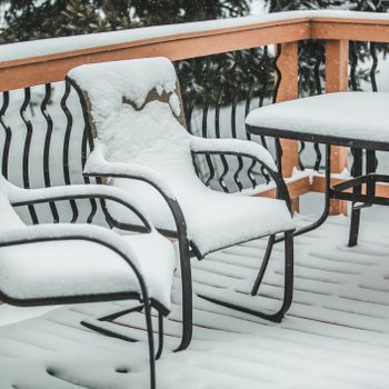 Patio Chairs and Table covered in snow