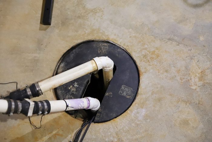 A sump pump in a home basement-plumbing repair