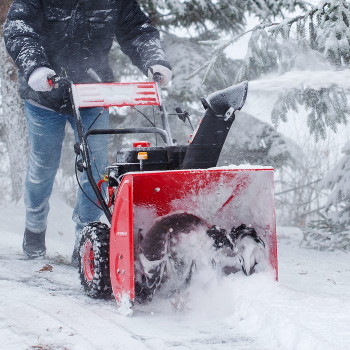 Gettyimages 1296077711 Man Using Snow Blower Machine To Clear Driveway Credit Anjelika Gretskaia