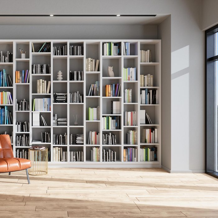 Reading Room Or Library Interior With Leather Armchair, Bookshelf And Floor Lamp