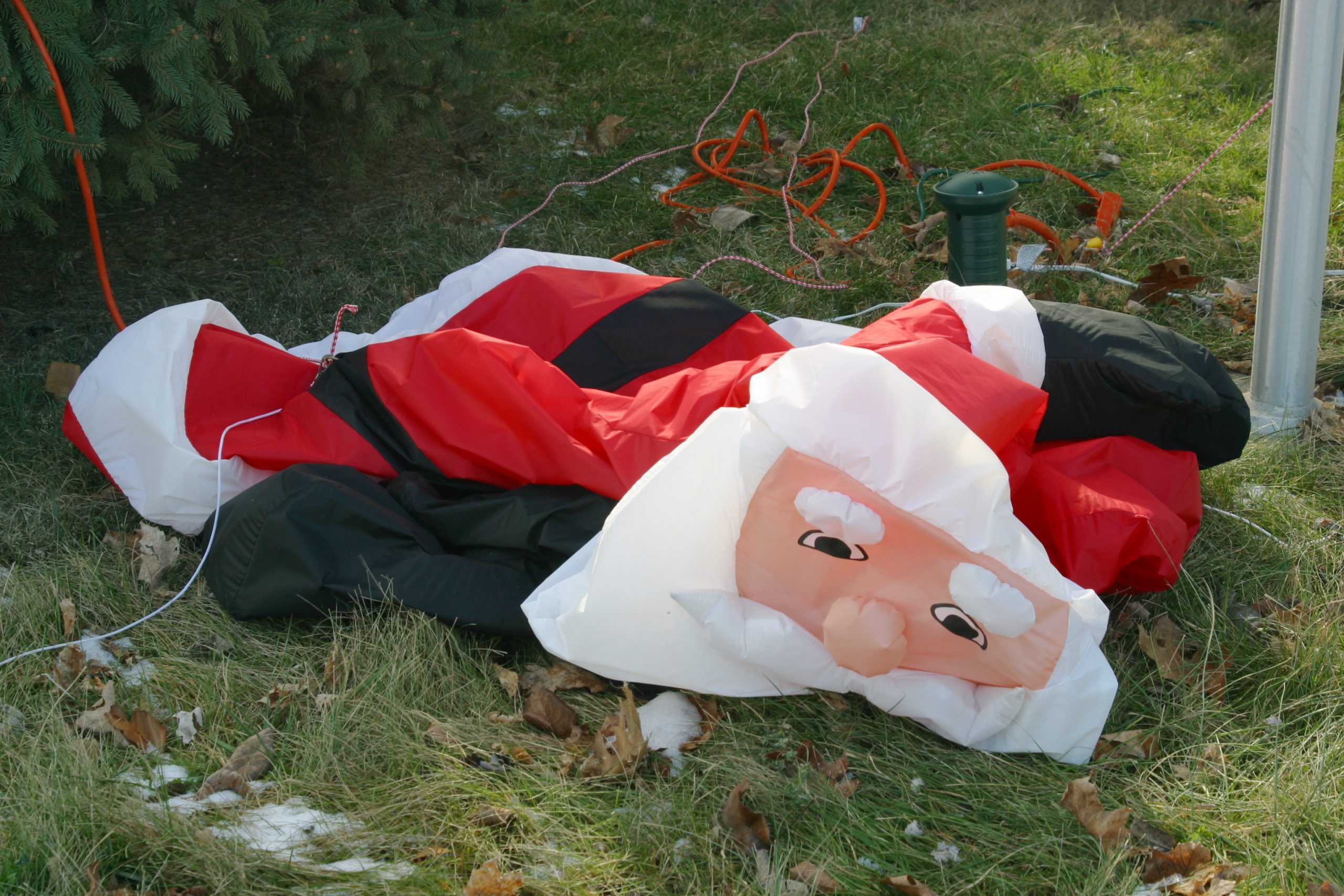 deflated Santa blow up lawn decoration