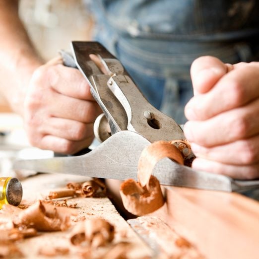 Detail of a carpenter planning wood