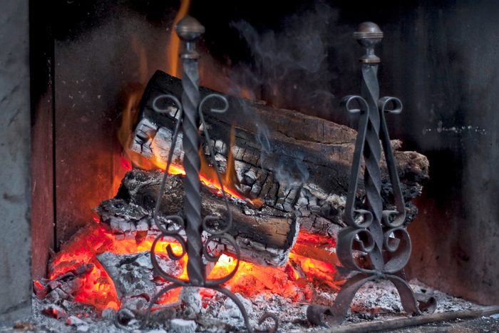 burning wood on a Fireplace Andirons