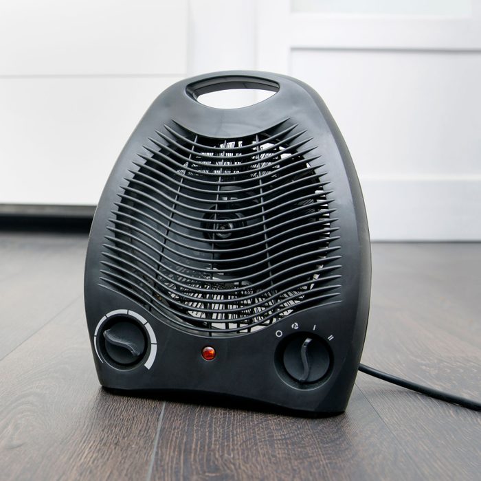 electric heater on laminate floor in the room