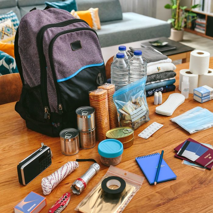 Emergency Backpack and Equipment Organized On The Table