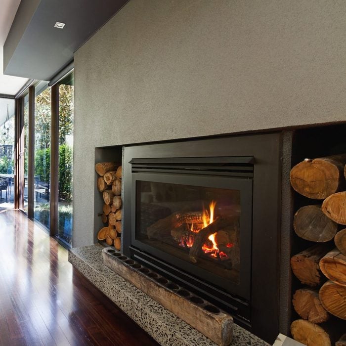 Cosy gas log fire in architect designed modern luxury open plan home