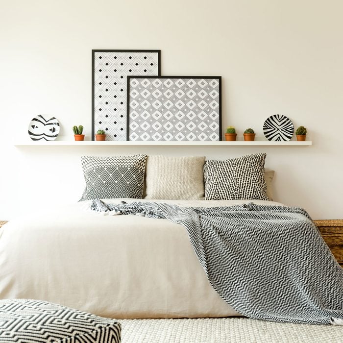Posters In Patterned Bedroom with white wall background