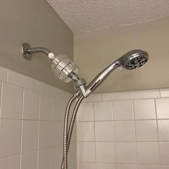 I Tried This Viral Shower Head Filter, And It Made My Hair Bouncier