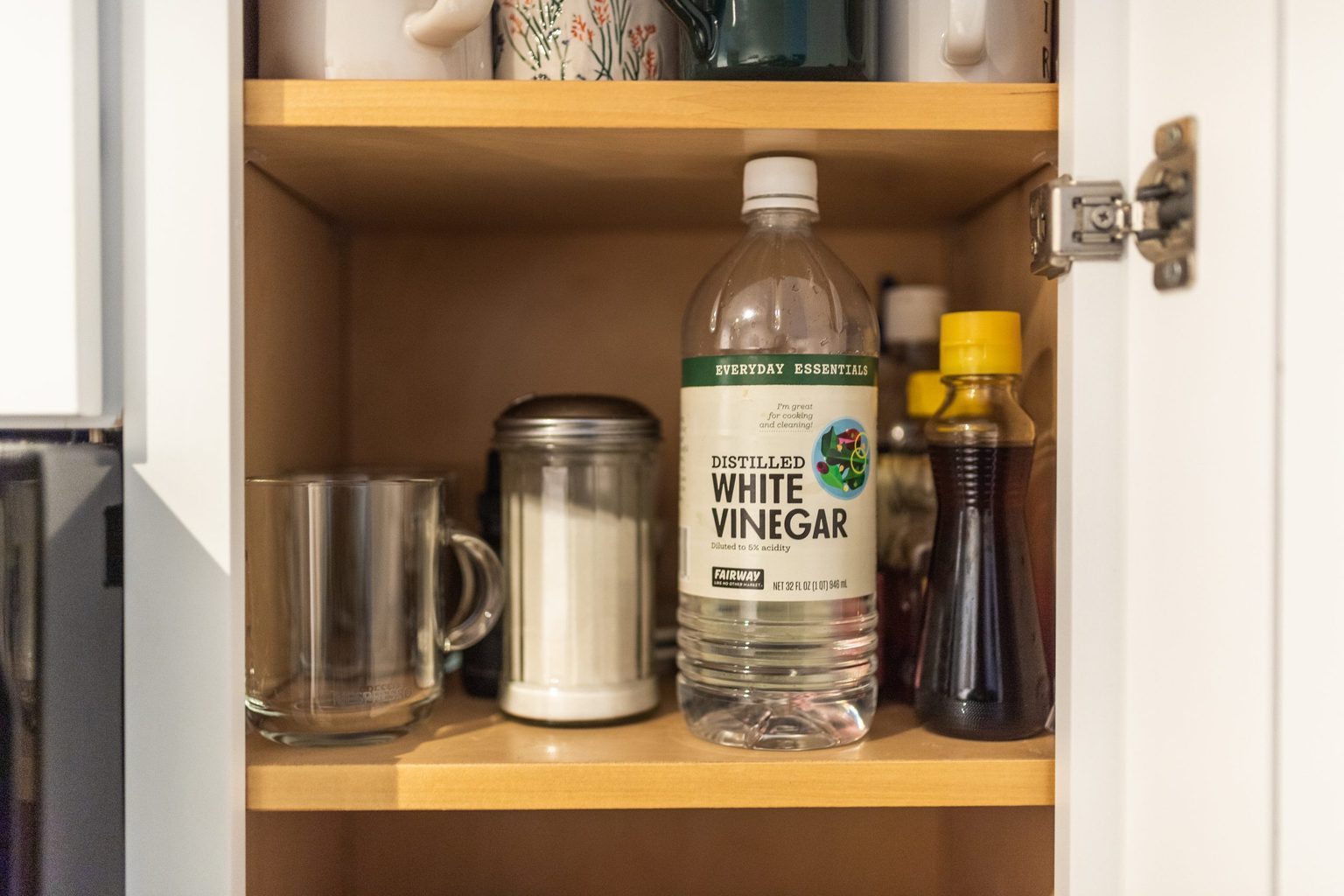 White Vinegar On Shelf In Cabinet