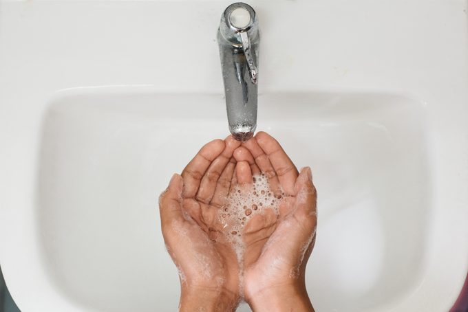 Cropped Image Of Person Washing Hands